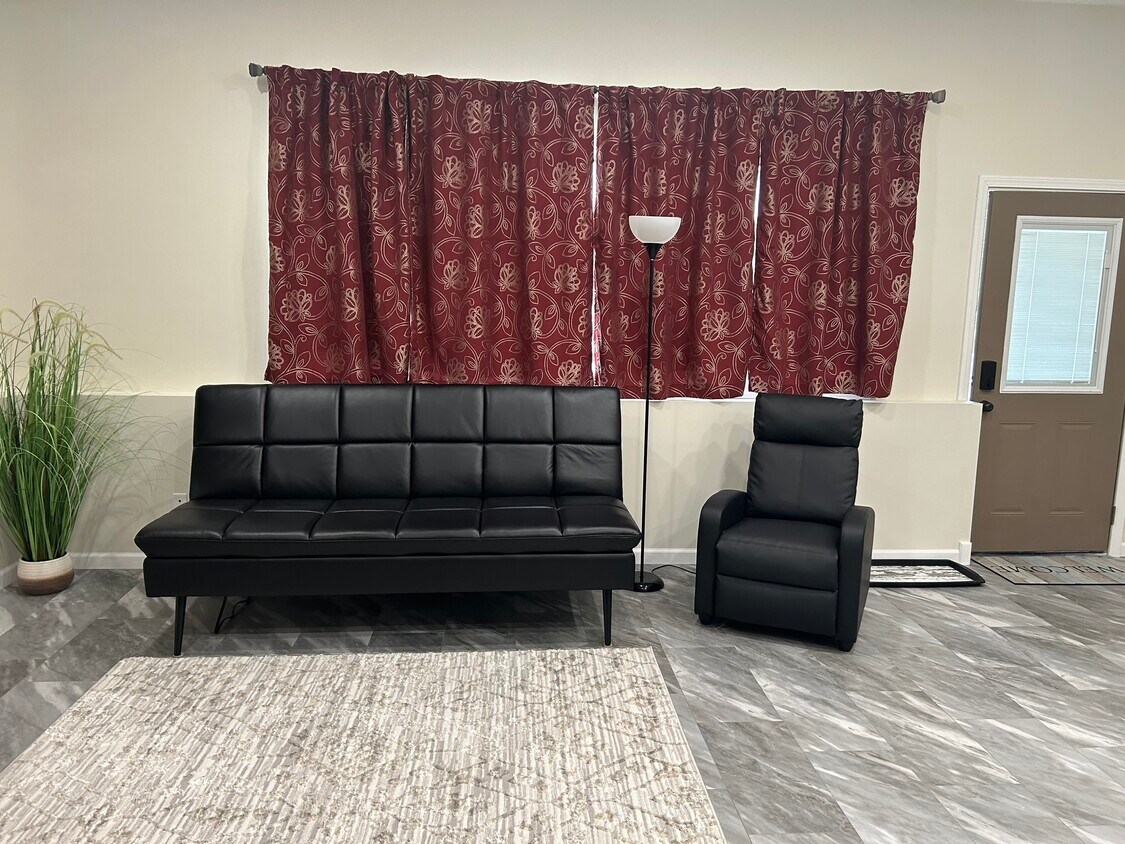 Futon lays down into bed, recliner lays flat - 812 Commercial St
