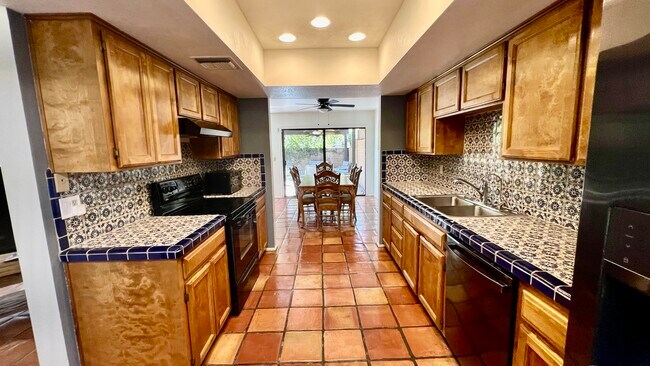Fully stocked kitchen with pots, pans, dish ware, glass ware, and silver ware. - 5010 E South Regency Cir