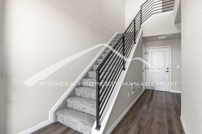 Building Photo - Contemporary Townhome in the Vibrant Interquest Low Maintenance Community with 2 car garage, Wash...