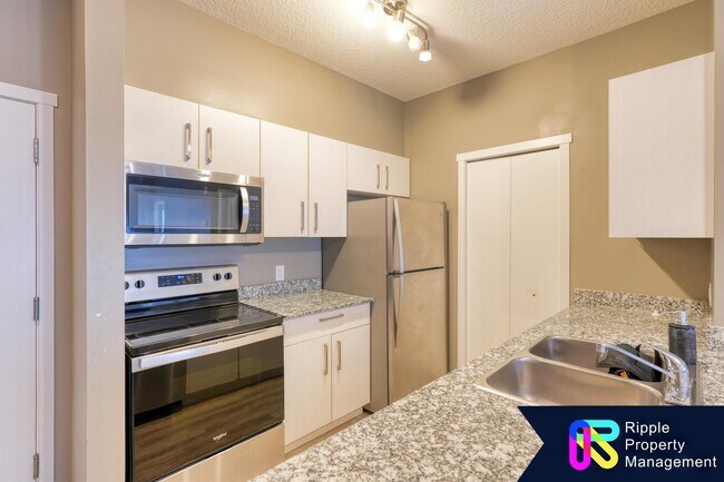 Photo du bâtiment - 4641-4128 Avenue Northeast - 3107 Ave