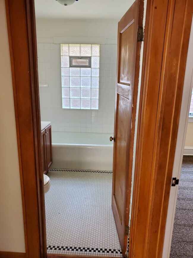 Bathroom glass block window w/ old soaker tub - 2373 N 56th St