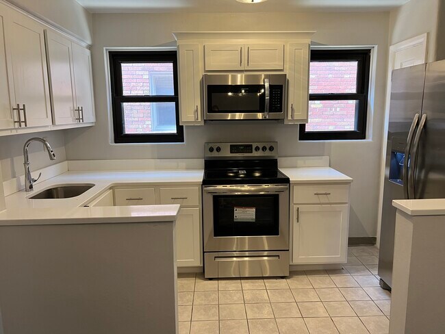 New Kitchen Cainets with white quartz counter top with stainless steel appliances - 5824 Nottingham Ave