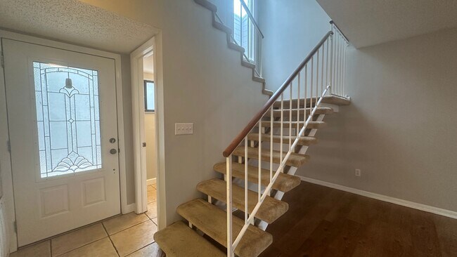 Building Photo - Spacious 3BR Townhome with Dual Living Areas & Resort Amenities