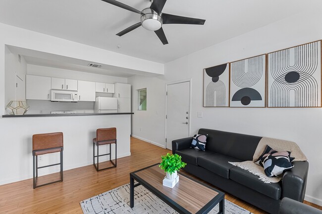 Green-Spring-Apartments-Near-TXST-Fully-Furnished-Living-Room-to-Kitchen - Green Spring