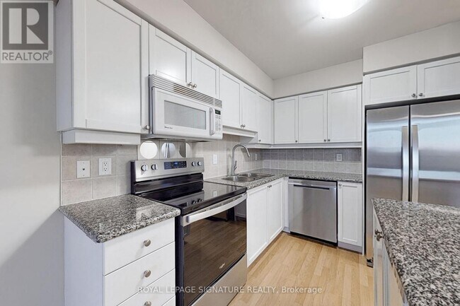 Photo du bâtiment - 80 Harrison Garden Blvd