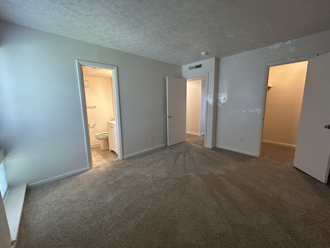 Primary Bedroom of a 3 Bedroom Unit - Huntingwood Apartments