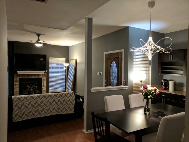 Voice-controlled lights and thermostat, Google Fiber internet (ultra fast 1Gbps), hardwood floors, spacious, open living room with a large comfy couch, 60" Samsung smart TV, and furnished dining room - 700 S 1st St