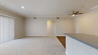 Located at 11711 Collett Ave in Riverside, CA, this single-story 2-bedroom, 2-bathroom home offers a well-designed, functional layout with modern finishes throughout. The open-concept living and kitchen area serves as the heart of the home, featuring crown molding, a ceiling fan, and a seamless transition between plush carpeting in the living space and wood-look flooring in the kitchen. An elegant arched passageway connects the living area to the hallway, adding an architectural detail that enhances the overall flow. The kitchen is well-appointed with white shaker cabinetry, gray countertops, stainless steel appliances including a refrigerator, range, microwave, and dishwasher, and a practical peninsula layout. Both bathrooms feature wood-look flooring, white cabinetry with gray countertops, and a tub/shower combo with clean tile surrounds. The bedrooms are carpeted and offer a comfortable retreat, with the primary bedroom benefiting from a walk-in closet equipped with wire shelving. A dedicated in-unit laundry room with a full-size washer and overhead shelving adds everyday convenience. The secondary bedroom enjoys a large window with outdoor views, allowing natural light to fill the space.