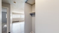Located in Colorado Springs, CO, this one-bedroom, one-bathroom unit offers a practical and efficiently designed floor plan across a single level. The galley-style kitchen is well-appointed with dark cabinetry, a mosaic tile backsplash, light countertops, wood-look flooring, and stainless steel appliances including a refrigerator, electric range, and over-the-range microwave — providing a functional cooking space despite its compact layout. The bedroom offers a comfortable, carpeted retreat with two windows that allow natural light to fill the room, complemented by a baseboard heating unit. A dedicated closet with built-in shelving and a hanging rod provides organized storage. The full bathroom features a tiled tub-shower combo, a dark-toned vanity with a rounded mirror, wood-look flooring, and brushed nickel fixtures and grab bars, creating a clean and practical space. Throughout the unit, textured ceilings and neutral gray walls contribute to a consistent, understated aesthetic. Wood-look flooring runs through the main living areas, while carpet adds warmth to the bedroom. This unit delivers a straightforward, no-frills layout well-suited for individuals or couples seeking functional living in Colorado Springs.