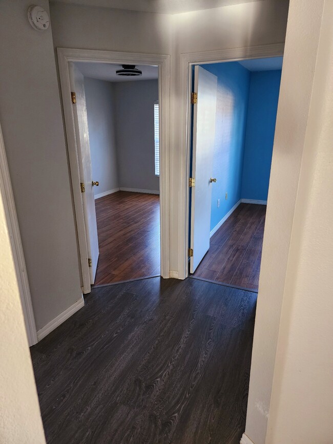 hallway with two bedrooms, linen closet, and bathroom - 141 Lookout Dr