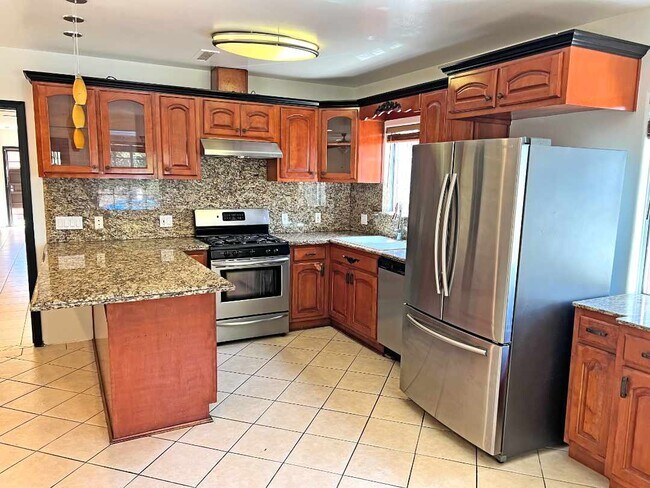 Kitchen from dining area. - 2330 S Mansfield Ave