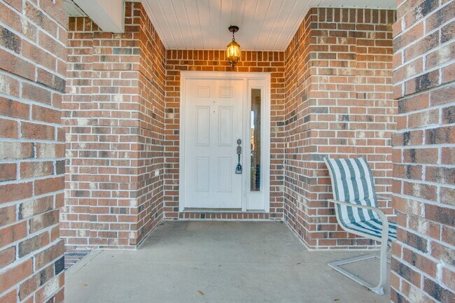 Building Photo - Energy-Efficient 3BR/2BA Solar Home in Pace with Screened Porch, Fenced Backyard, Updated Kitchen...