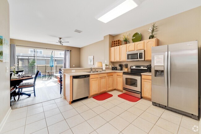 kitchen and great room/pool access 1st fl - 7663 Sir Kaufmann Ct