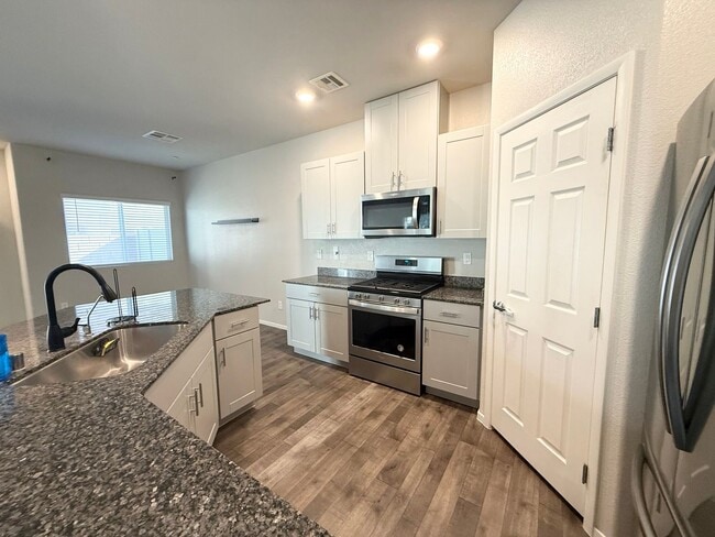 Building Photo - Modern 3-Bedroom townhome with Open Layout, Community Pool & Prime Location