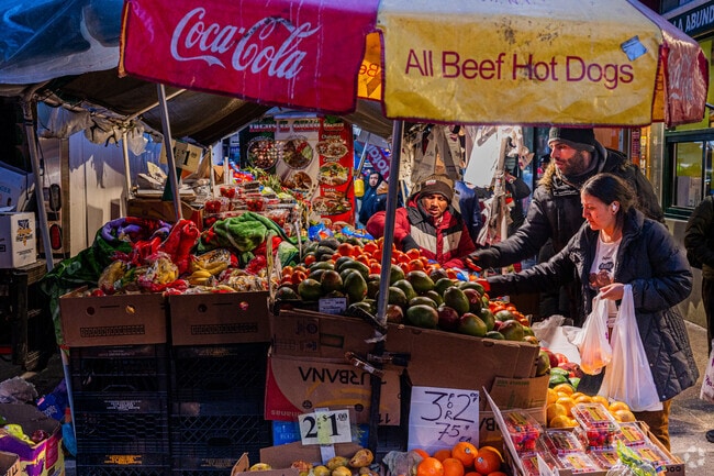 Street vendors display their fresh fruits and veggies in Woodside streeets.