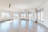 Located at 3400 Sharon Road in Charlotte's sought-after 28211 corridor, this well-appointed 2-bedroom, 5-bathroom single-floor residence offers a refined living experience with thoughtful finishes throughout. The open living area is bathed in natural light through expansive floor-to-ceiling windows with outdoor views, showcasing wide-plank hardwood flooring and track lighting overhead. Elegant arched hallways connect the main living spaces, which feature warm travertine tile flooring that flows through the kitchen, hallways, and bathrooms. The kitchen is equipped with white shaker cabinetry, a white quartz countertop, a classic subway tile backsplash, and stainless steel appliances including a French door refrigerator. The primary bathroom offers a soaking tub with travertine surround, a dual-sink vanity with quartz countertops and matte black fixtures, and a walk-in closet outfitted with a full modular shelving system. Secondary bedrooms feature plush carpeting and ceiling fans. Additional highlights include five bathrooms with consistent white cabinetry and round mirror accents, a dedicated laundry room with side-by-side washer and dryer and overhead cabinetry, and two well-organized closets. The layout flows efficiently across the single floor, combining functional design with polished, contemporary finishes.