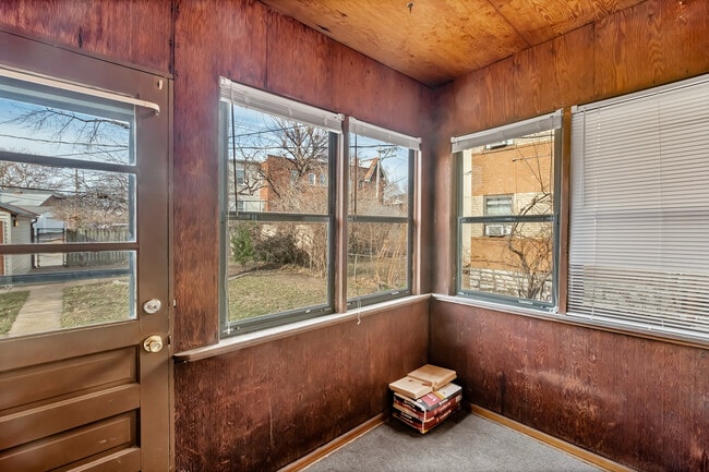 Enclosed porch can function as a 3 seasons room or makes the perfect mudroom with just a few benches. - 3443 Lawn Ave