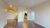 Located at 5240 Rocklin Rd in Rocklin, CA, this 2-bedroom, 2-bathroom residence offers a practical and well-appointed single-floor layout. The living room serves as the heart of the home, featuring rich wood-look flooring, neutral walls, a ceiling fan, and a large window that fills the space with natural light. An entry door with an adjacent window further brightens the area, creating a warm and welcoming ambiance.

The kitchen is efficiently designed with white cabinetry, granite-style countertops, and a full suite of stainless steel appliances including a refrigerator, range, and dishwasher. Wood-look flooring continues throughout, tying the kitchen seamlessly to the main living area.

Both bedrooms are comfortably sized and finished with plush carpeting and window blinds for light control and privacy. The primary bedroom includes a sliding glass door opening to a private outdoor patio, offering a pleasant indoor-outdoor connection. A dedicated closet provides convenient storage.

The two bathrooms are clean and functional, each featuring a full tub/shower combination with chrome fixtures and neutral finishes. The overall design emphasizes a consistent, understated aesthetic with light-toned walls and quality finishes throughout, making this a comfortable and move-in ready residence.