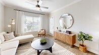 Located at 4630 S Lakeshore Dr in Tempe, Arizona, this thoughtfully designed one-bedroom residence offers a cohesive, light-filled layout ideal for comfortable everyday living. The living room is bright and inviting, featuring light wood-style flooring, crown molding, a ceiling fan, and large windows dressed with white linen curtains and horizontal blinds that allow generous natural light to fill the space. A sliding door provides direct outdoor access, enhancing the open feel of the room.

The kitchen is well-equipped with gray shaker-style cabinetry, stainless steel appliances including a refrigerator, electric range, and microwave, as well as a white quartz peninsula countertop with bar seating for two — ideal for casual dining and entertaining. The layout connects seamlessly to the living area, supporting an open flow throughout.

The bedroom is a comfortable retreat, featuring a ceiling fan, sliding glass door leading to a private patio, a dedicated closet, and ample room for a full furniture arrangement. Light wood flooring continues throughout, tying the aesthetic together cohesively.

The bathroom includes a full tub-shower combination with a curved rod, wood-look flooring, and a clean, neutral palette. A hallway connects the key areas of the home efficiently, completing this functional and stylish single-floor residence.