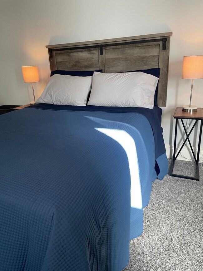 Queen sized bed in HUGE primary bedroom. - 28 Saint James Pl