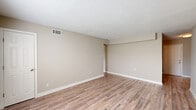 Located at 3775 Houston Ave in Macon, Georgia, this two-bedroom, one-bathroom single-story home offers a practical and comfortable layout with consistent finishes throughout. Wood-look flooring runs throughout the main living areas and bedrooms, complemented by neutral beige walls and white baseboards that create a clean, cohesive aesthetic. Textured ceilings add a classic touch to each room.

The living room is an open, well-proportioned space with a closet and direct access to adjacent areas of the home. The kitchen is efficiently designed, featuring white cabinetry, light granite-style countertops, a black refrigerator, and a black range with overhead ventilation — all set atop matching wood-look flooring with a window providing natural light.

Both bedrooms are comfortable in size, each equipped with ceiling fans and closet space. The primary bedroom includes a double-door closet and a window. The second bedroom also benefits from a ceiling fan and a window with an outdoor view. The home features an impressive six closets in total, providing exceptional storage capacity throughout.

The bathroom presents a clean, functional design with brown tile flooring, a tub-shower combination, and a window for natural ventilation. A hallway connects the main areas of the home, keeping the layout easy to navigate.