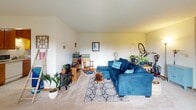 Located at 2220 Pascal St in Roseville, MN, this single-floor home offers a well-organized layout across several functional spaces. The living room serves as the heart of the home, featuring carpet flooring, a ceiling fan, and room for generous seating arrangements. A freestanding decorative stove adds character to the living area, complementing the relaxed, welcoming ambiance throughout.

The galley-style kitchen is efficiently arranged with warm wood cabinetry lining both sides, providing ample storage and counter space. White appliances, including a range, dishwasher, and refrigerator, are neatly integrated, and durable tile-style flooring grounds the space practically.

Adjacent to the kitchen, the dining area benefits from multiple windows that invite natural light and offer views of the surrounding greenery outside. A ceiling fan overhead adds comfort to this cheerful space.

The primary bedroom is carpeted and features a ceiling fan, providing a calm retreat. A second bedroom currently serves as a home office, with a window allowing natural light to fill the room. The full bathroom includes tile flooring, a tub-shower combination, and a vanity with wood cabinetry, offering a clean and functional design throughout.