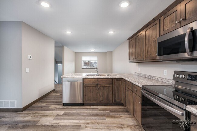 Building Photo - SPACIOUS AND MODERN TOWNHOME