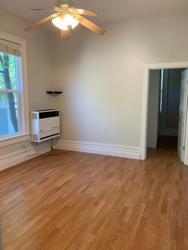 Living room looking toward bedroom and outside - 311 Lakeville St