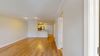 Located at 5260 Rogers Rd in Hamburg, NY, this single-floor, 2-bedroom, 1-bathroom home offers a well-designed layout with a comfortable, functional flow throughout. The open-concept living and dining area is anchored by warm hardwood flooring, crown molding, and a textured ceiling, creating a bright and welcoming atmosphere. A pass-through counter connects this space to the kitchen, which features white cabinetry, granite countertops, tile flooring, and a full suite of stainless steel appliances including a range, microwave, and refrigerator. The spacious primary bedroom offers generous square footage and includes closet space, while the second bedroom is carpeted and brightened by a large window with outdoor views. Both bedrooms provide a calm, neutral palette. The full bathroom is finished with granite countertops, a white vanity with ample cabinet storage, tile flooring, and a well-lit vanity mirror. The home also includes a dedicated laundry area, a hallway connecting all rooms, and an attached garage. With seven closets throughout, storage is plentiful. Crown molding and consistent finishes lend a cohesive, polished character to the entire home.