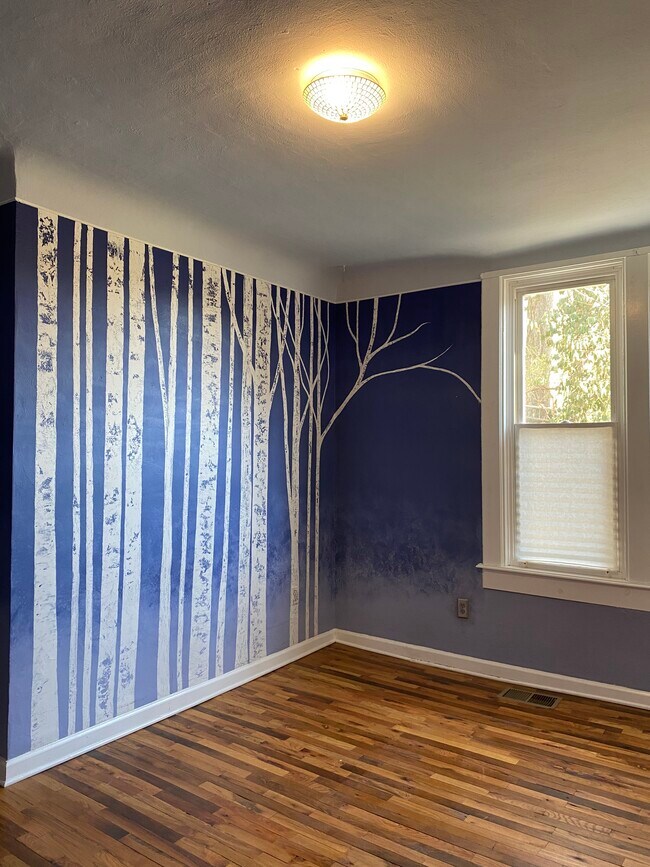 Birch tree mural in bedroom - 5920 Kellogg Ave Apartments
