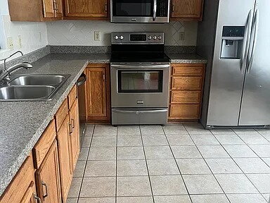 Building Photo - The home features beautiful LVP flooring, granite countertops, stainless steel appliances, and a ...