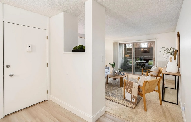 Building Photo - The updated bathroom offers a shower-over-...