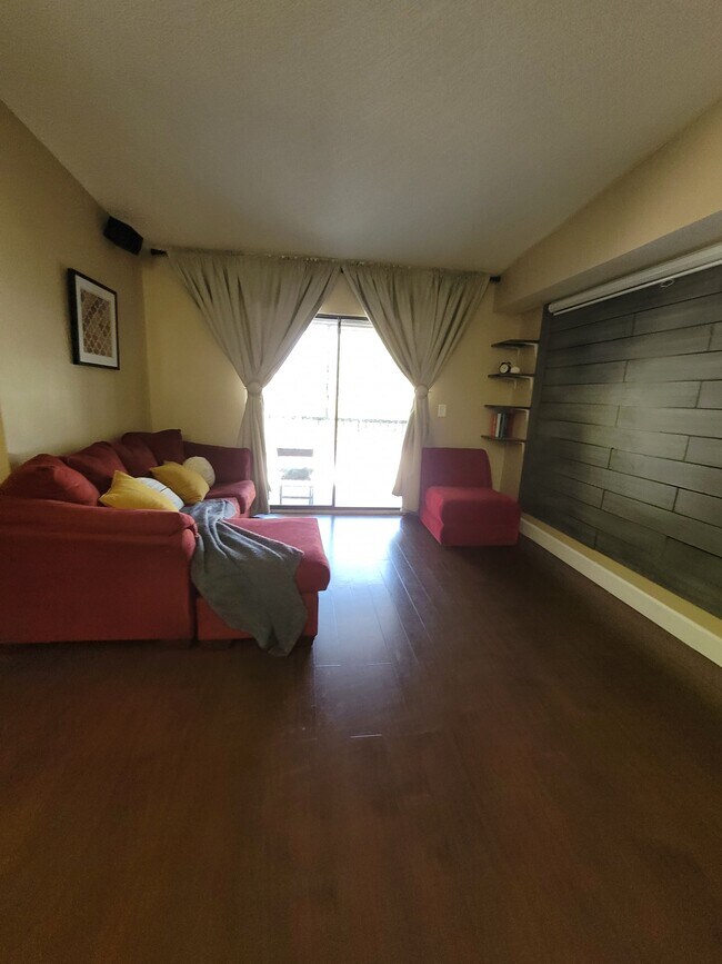 Living room area sits 4 people comfortably and has amble space for additonal seating! - 19800 SW 103rd Ct