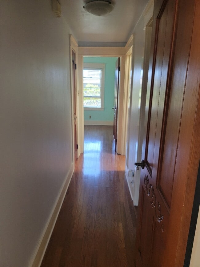 Hallway with closet with double shelves - 642 W 8th St
