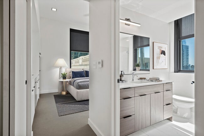 The bathroom and living space of The Script at Midland Lofts - Midland Lofts