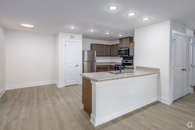 3 habitaciones, 2 baños - 1318 pies cuadrados - Cocina y comedor - Brookfield Pointe Apartments