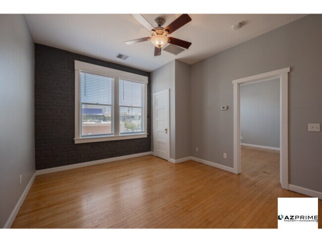 Building Photo - Experience the Allure of Downtown Living i...
