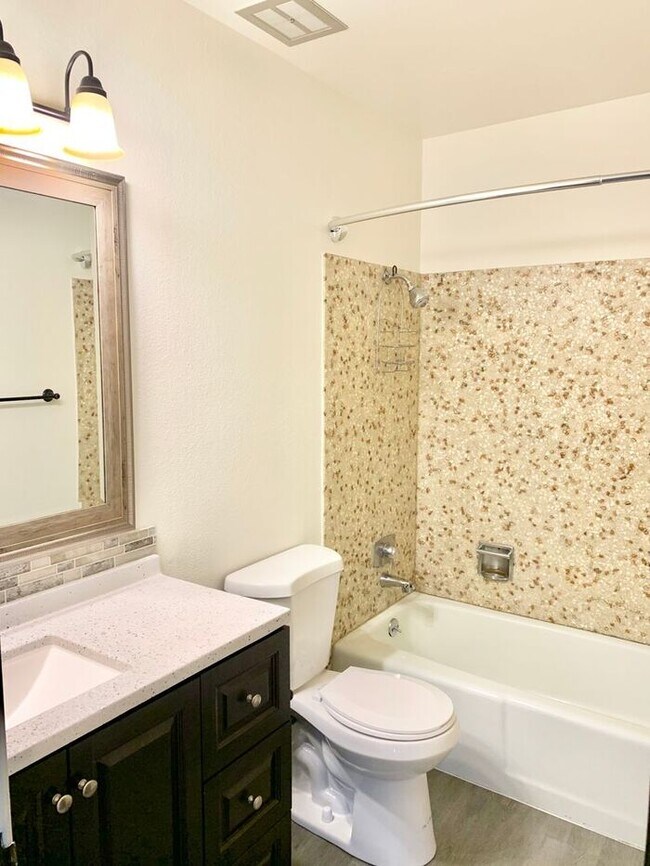 Building Photo - Spacious 2-Bedroom Apartment with Massive Private Deck, Covered Parking & Utilities Included!