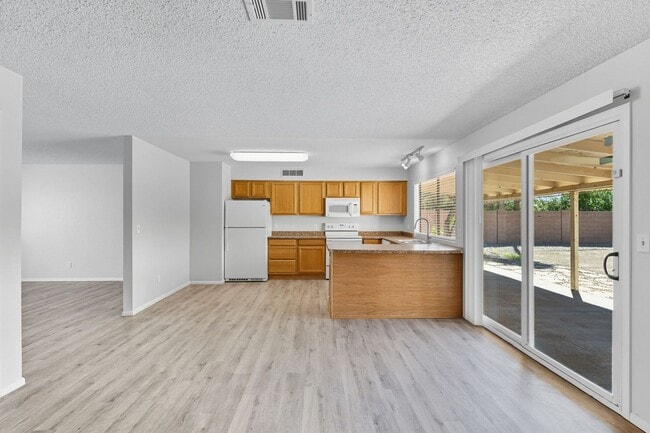 Building Photo - Three bedrooms plus big garage!