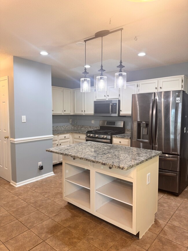 Kitchen with stainless steel appliances - 144 Swan Quarter Dr