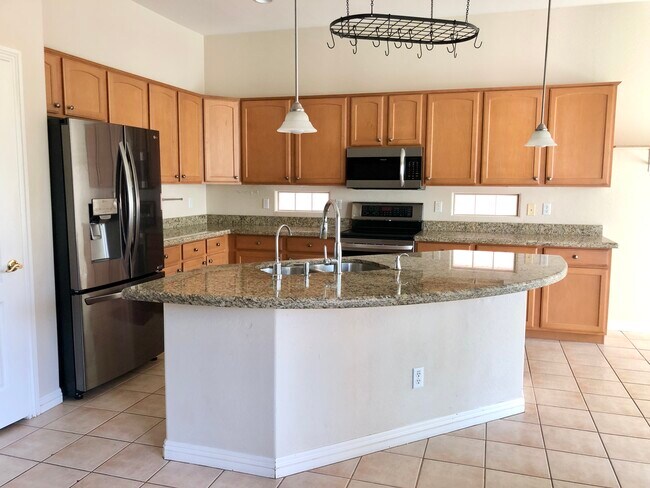 Modern, stainless steel kitchen appliances are provided. Granite countertops. - 1817 E Glacier Pl