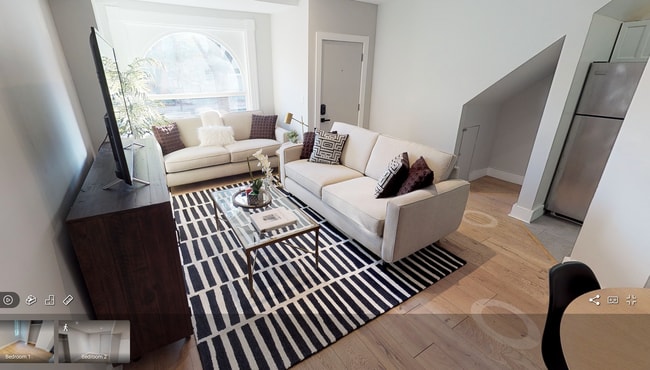 Living Room w/ lots of natural light - 1015 P St NW Apartments