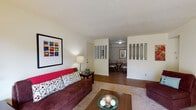 Located at 115 La Fontenay Dr in Louisville, Kentucky, this single-floor residence offers a well-organized and functional layout across several distinct living areas. The living room is generously sized, featuring carpet flooring, a textured ceiling, and a sliding glass door that opens to a private outdoor patio, allowing natural light to fill the space. A partial dividing wall with decorative spindles separates the living room from the dining area, creating defined yet open zones. The dining room features warm wood-look flooring and patterned wallpaper, adding a classic touch to the space. The kitchen is equipped with dark wood cabinetry, light countertops, a double sink, dishwasher, refrigerator, and a range, with wood-look flooring throughout. The primary bedroom is carpeted and well-lit by a large window, offering a calm and comfortable retreat, while a second bedroom provides a cozy, intimate space. The bathroom includes a vanity with ample counter space, cabinetry, and a shower-tub combination. Additional storage is available via a walk-in closet adjacent to the bathroom. The home combines practical design with comfortable living spaces suitable for a variety of lifestyles.