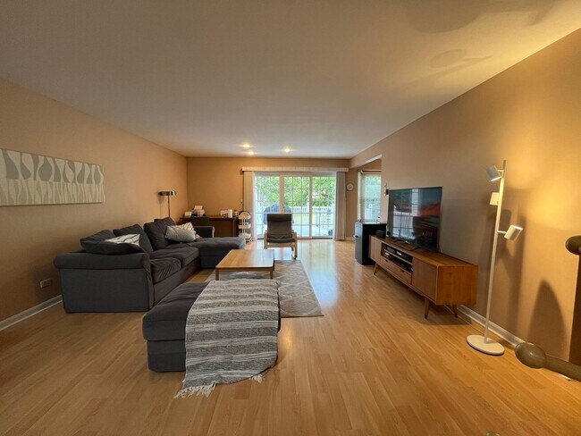 Spacious Living Room with triple sliding patio door - 4891 Turnberry Dr