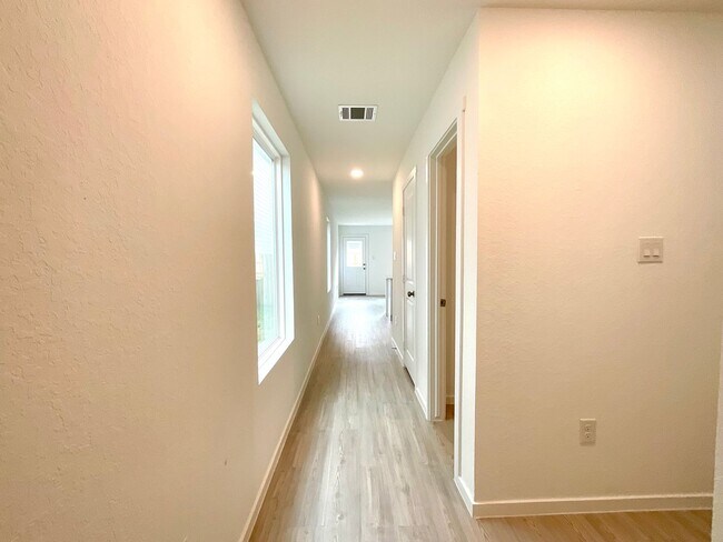 Photo - Modern 3-Bed, 2.5-Bath Home with Included Internet & Fenced Backyard in a Growing Community