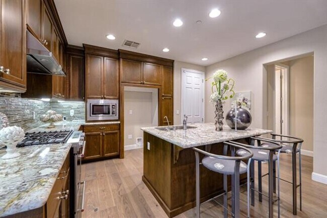 Building Photo - Impressive Two-Story, End Unit Townhome in...