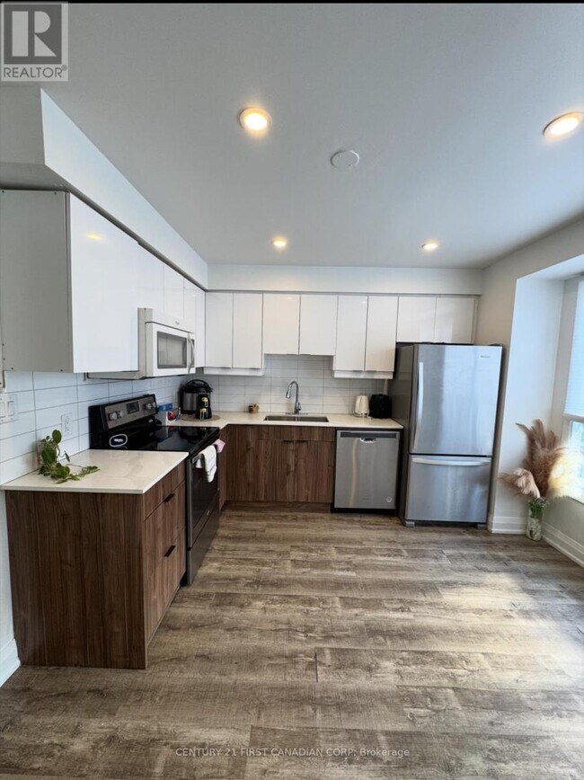 Photo du bâtiment - 135-135 Belmont Dr