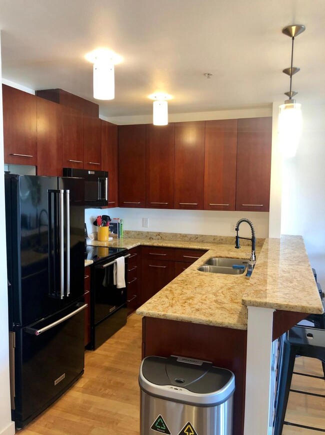 Kitchen with updated appliances, granite counter tops - 655 Crockett St