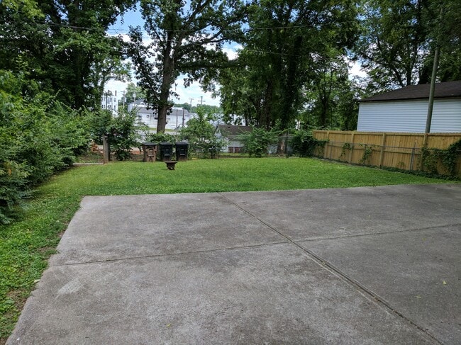 Parking area in back with backyard - 2418 Brasher Ave Townhome