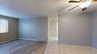 Located at 670 Prospect St in Berea, Ohio, this single-floor, one-bedroom, one-bathroom unit offers a well-organized and functional layout. The combined living and dining area serves as the heart of the unit, featuring durable laminate wood flooring, cool-toned gray walls, a ceiling fan, and a window that brings in natural light. The space transitions seamlessly to a tile-floored hallway connecting the remaining rooms. The kitchen is equipped with white appliances, including a refrigerator and electric range, complemented by warm wood-toned cabinetry and tile flooring. The bedroom is carpeted for comfort, featuring a large window with an outdoor view, providing a bright and quiet retreat. The bathroom includes a full tub and shower combo with clean white surrounds. Three closets offer generous storage throughout the unit, while a dedicated utility room adds practical functionality. The unit's cool gray palette, consistent throughout, creates a calm and cohesive atmosphere. With its compact yet complete layout, this unit provides all the essential spaces needed for comfortable everyday living.